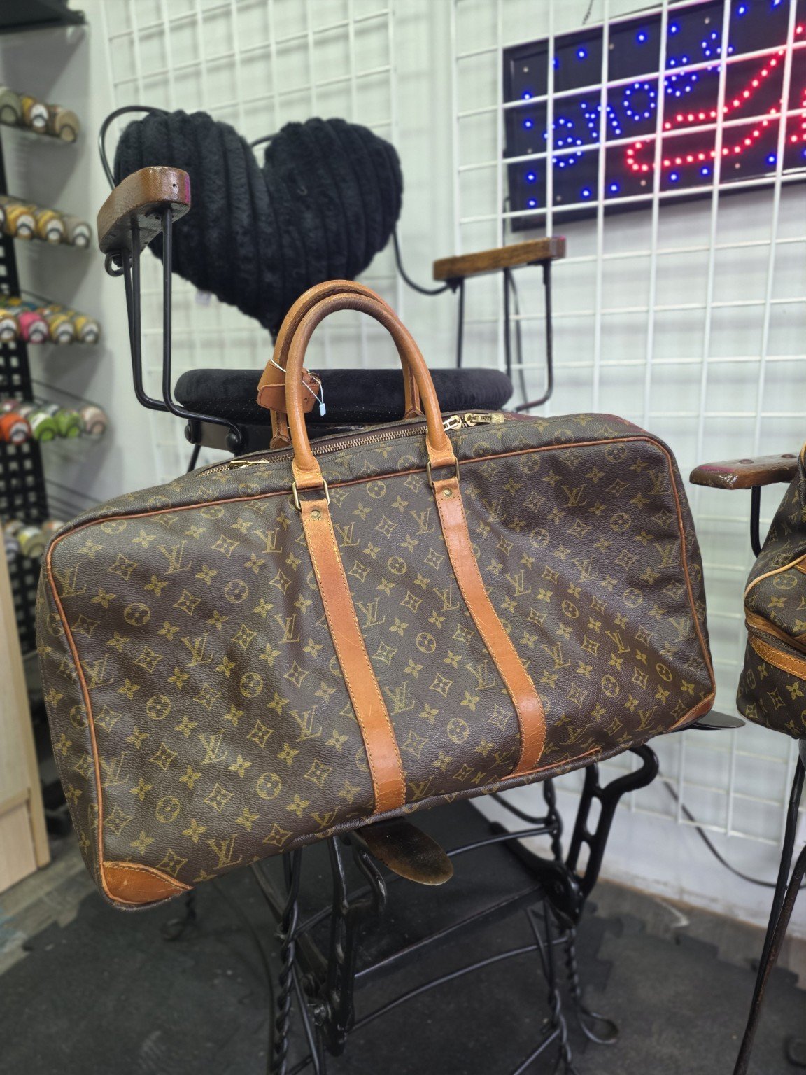 Louis Vuitton travel bag leather repair at College Park
